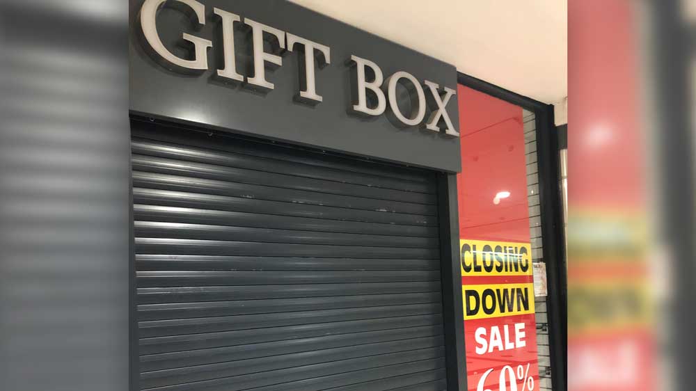 Gift Box Uxbridge, front window closing down signs