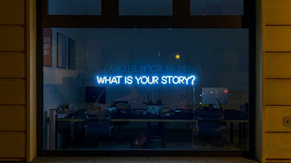 What's your story neon sign in window